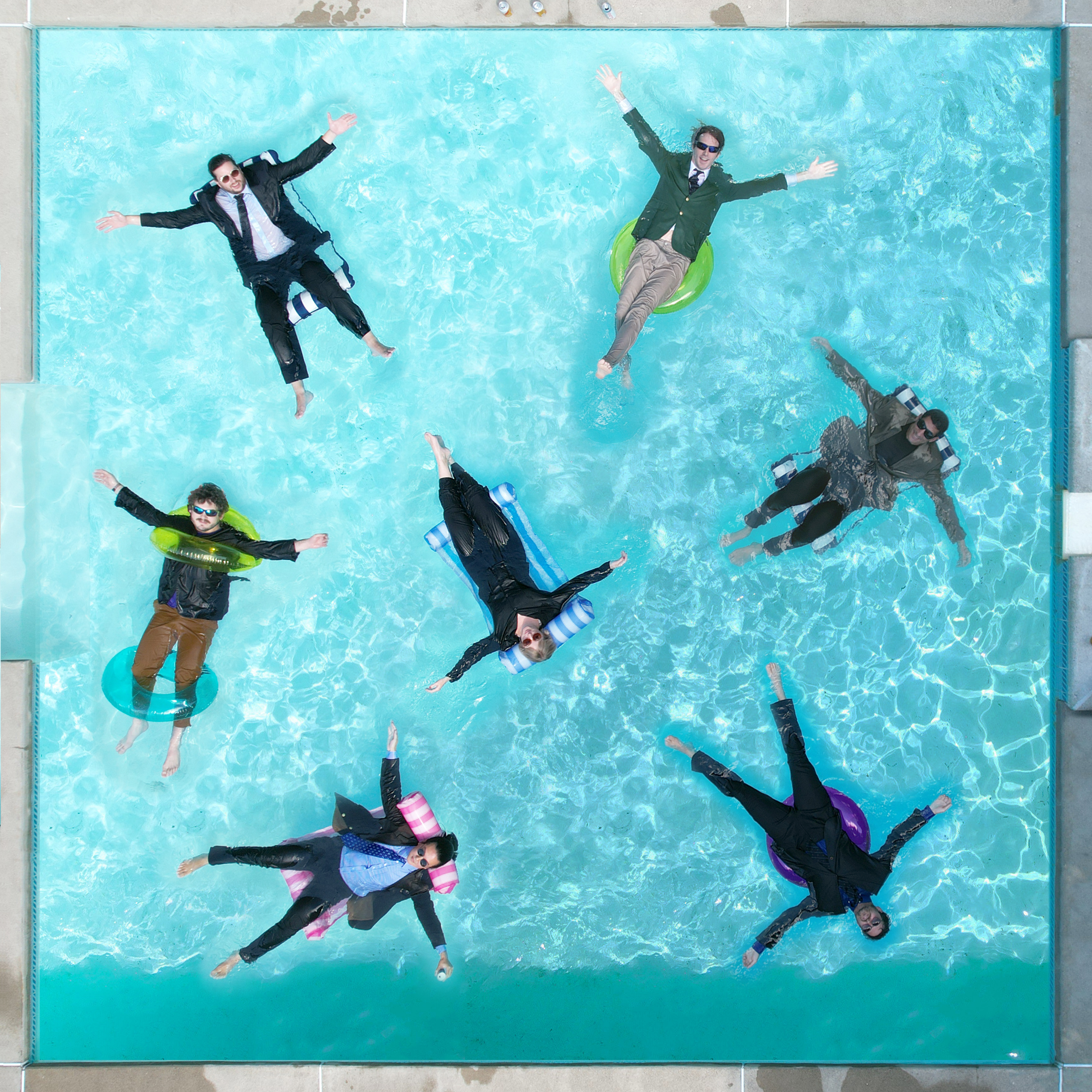Keper Sauce Studios floating in a pool –photographed from overhead.